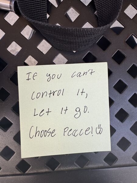 Handwritten sticky note with words of encouragement